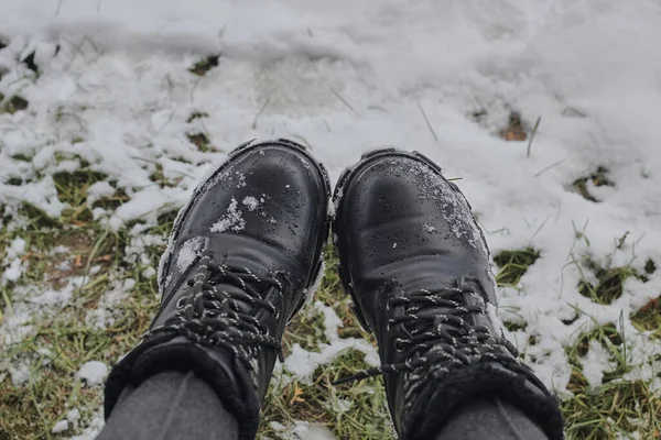Black beautiful footwear in the background snow in winter.