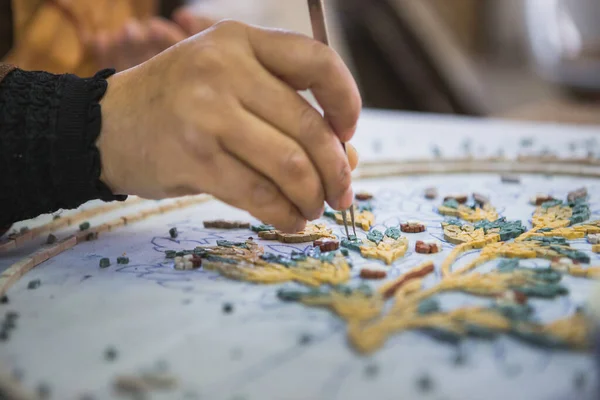 Artist, Mosaic Tools, Hand Craft, Uses Tweezers To Make Mosaic, Close Up. Ancient process of making mosaics. Madaba, Jordan.