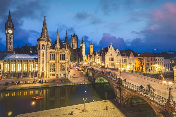 High point of view of Medieval city of Gent in Flanders with Saint Nicholas Church and Gent Town Hall, Belgium. Sunset cityscape of Gent.