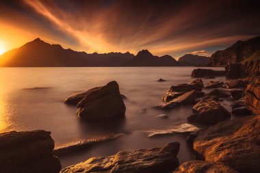 Sunset at the Elgol beach clipart