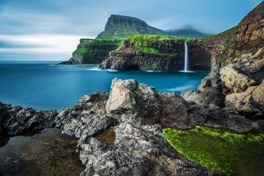 Gasadalur waterfall in Vagar, Faroe Islands clipart