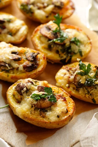 Potato skins loaded with mushrooms, onion, herbs and melted cheese — Stock Image Potato skins loaded with mushrooms, onion, herbs and melted cheese Stock Picture