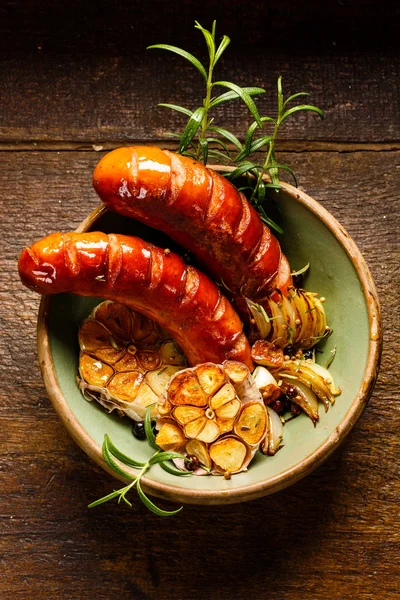 Roasted sausage with garlic and herbs — Stock Photo, Image