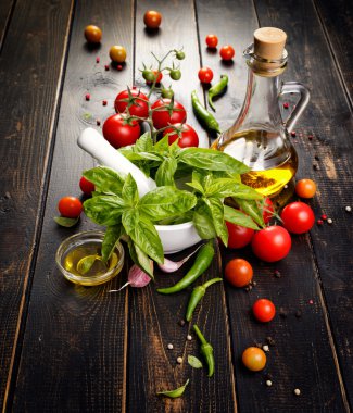 Fresh basil, cherry tomatoes and olive oil
