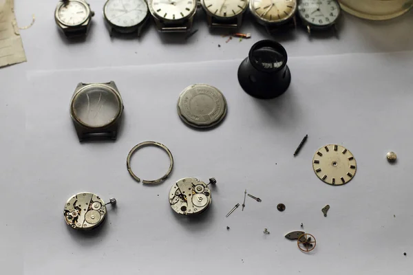 Crafts man repairing vintage watches