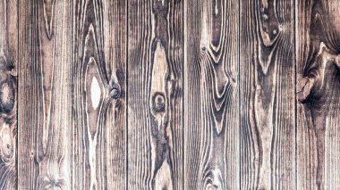 Arka plan olarak güzel bir dokusu ve düğümleri olan eski ahşap tahta.