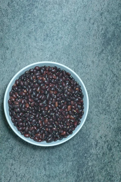 Black Beans Ceramic Bowl Dark Marble Surface — Stock Photo, Image