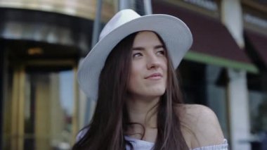 Young and Beautiful Female is Looking in Camera Smiling Flirting