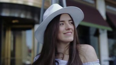 Young and Beautiful Female is Looking in Camera Smiling Flirting