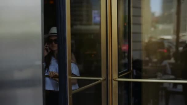 Elegant Lady Goes Out From Hotel Through Revolving Doors. — Stock Video