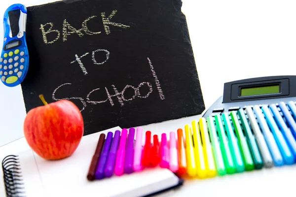 Back to school supplies and an apple for the teacher — Stock Photo, Image
