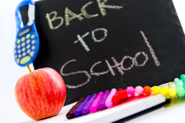 Back to school supplies and an apple for the teacher — Stock Photo, Image