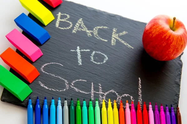 Back to school supplies and an apple for the teacher — Stock Photo, Image