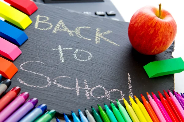 Back to school supplies and an apple for the teacher — Stock Photo, Image