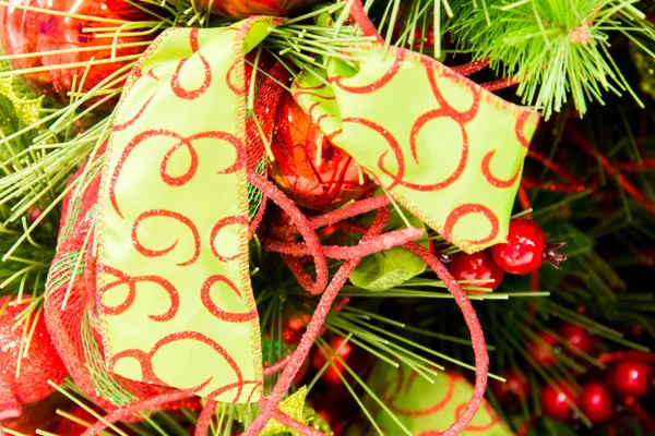 Christmas decorations, green and red bow — Stock Photo, Image