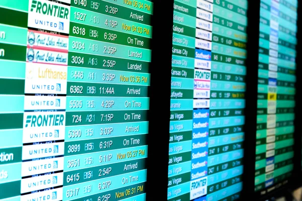 Flight information display screens at an airport — Stock Photo, Image