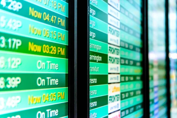 Flight information display screens at an airport — Stock Photo, Image
