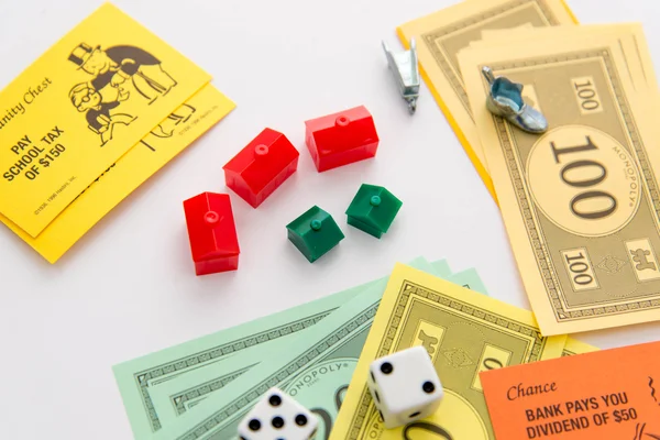 Monopoly board game in play — Stock Photo, Image