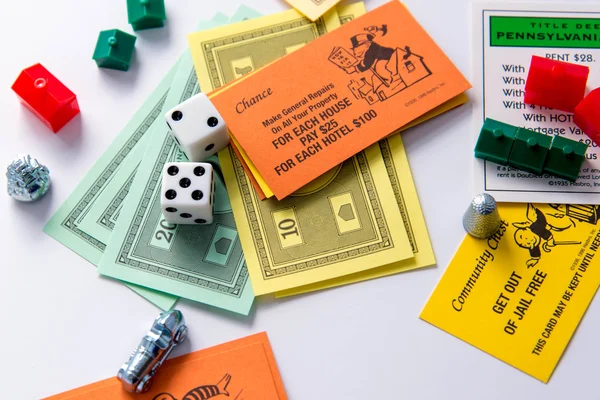 Monopoly board game in play — Stock Photo, Image