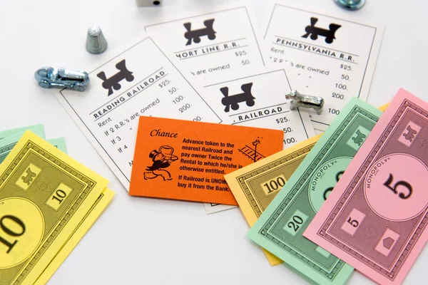 Monopoly board game in play — Stock Photo, Image