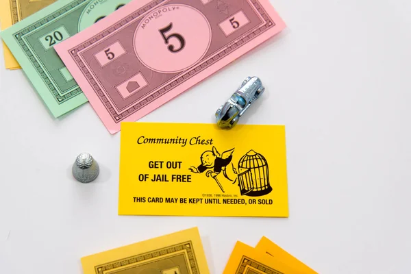 Monopoly board game in play — Stock Photo, Image