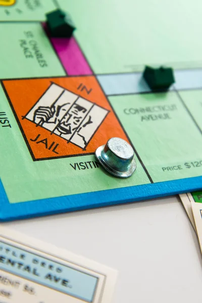 Monopoly board game in play — Stock Photo, Image