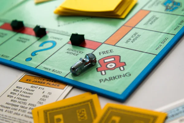 Monopoly board game in play — Stock Photo, Image