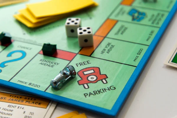 Monopoly board game in play — Stock Photo, Image