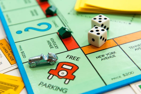 Monopoly board game in play — Stock Photo, Image