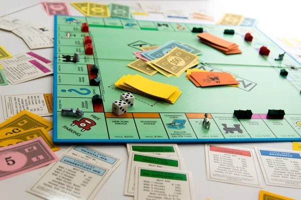Monopoly board game in play — Stock Photo, Image