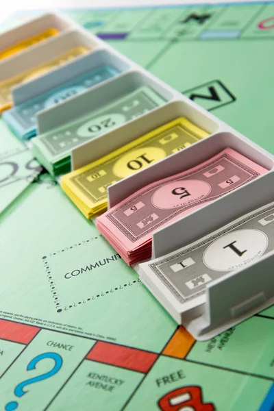 Monopoly board game in play — Stock Photo, Image