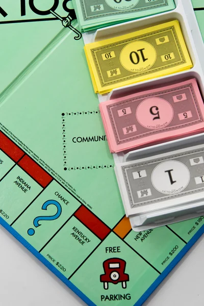 Monopoly board game in play — Stock Photo, Image