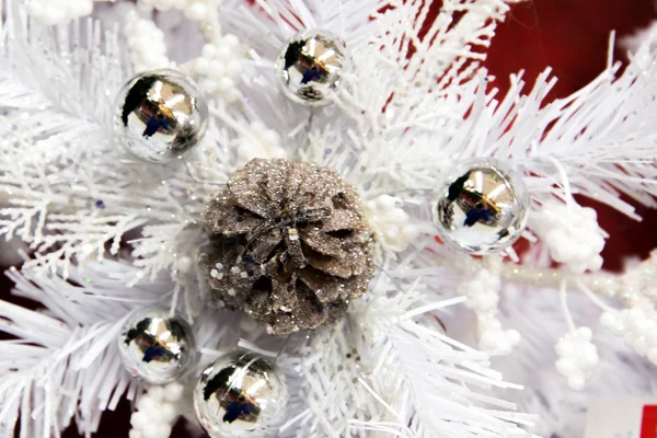 Christmas decorations - white snowflake with pinecone and silver — Stock Photo, Image