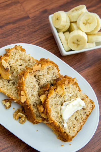 Fresh buttered banana walnut bread — Stock Photo, Image