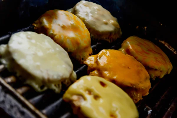 Cheeseburgers on the grill — Stock Photo, Image