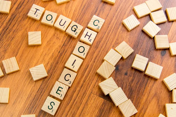 Scrabble letters - TOUGH CHOICES — Stock Photo, Image