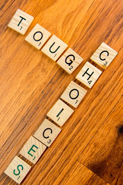 Scrabble letters - TOUGH CHOICES — Stock Photo, Image