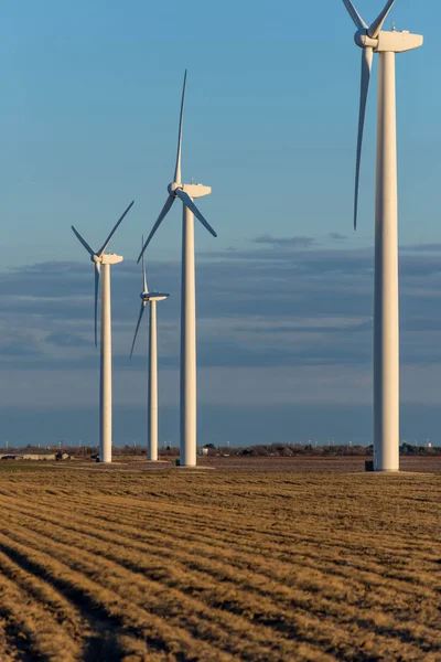 Renewable energy - wind turbines in rural hay fields — Stock Photo, Image