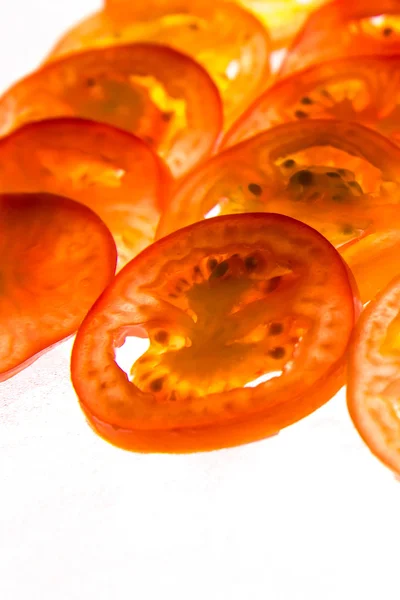 Backlit sliced red tomatoes — Stock Photo, Image