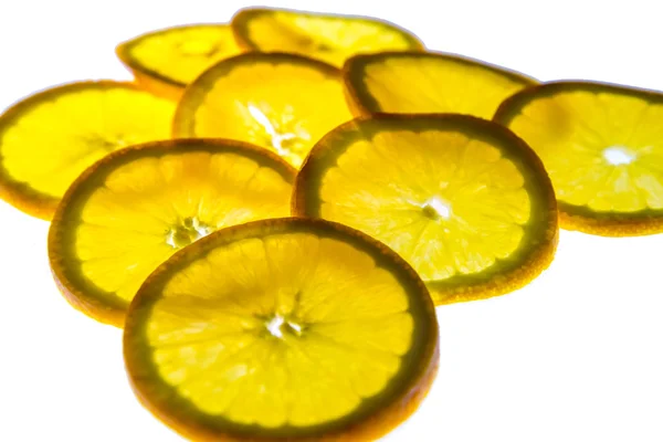Fatias de laranja retroiluminadas — Fotografia de Stock