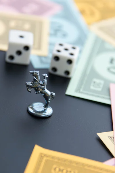 February 8, 2015: Houston, TX, USA.  Monopoly horse, dice and mo