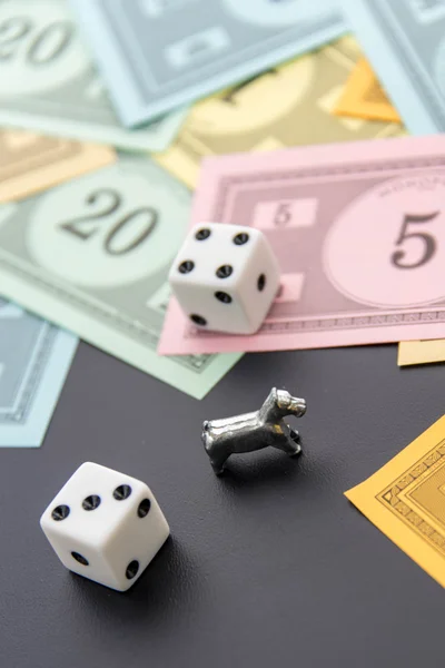 February 8, 2015: Houston, TX, USA.  Monopoly dog, dice and mone — Stock Photo, Image