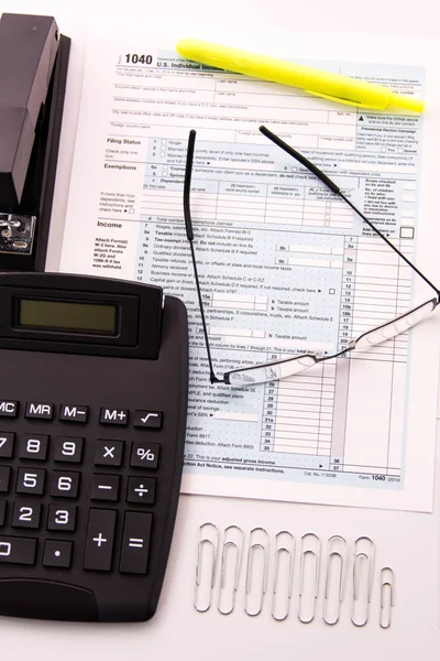 Tax preparation supplies, reading glasses and tax forms — Stock Photo, Image