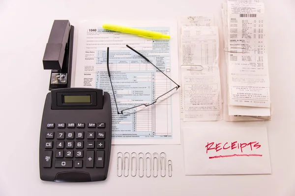 Tax preparation supplies, reading glasses and tax forms — Stock Photo, Image