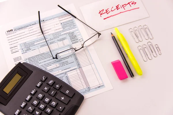 Tax preparation supplies, reading glasses and tax forms — Stock Photo, Image