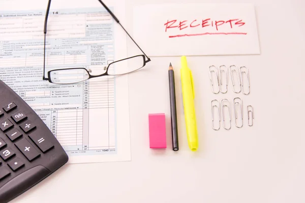 Tax preparation supplies, reading glasses and tax forms — Stock Photo, Image