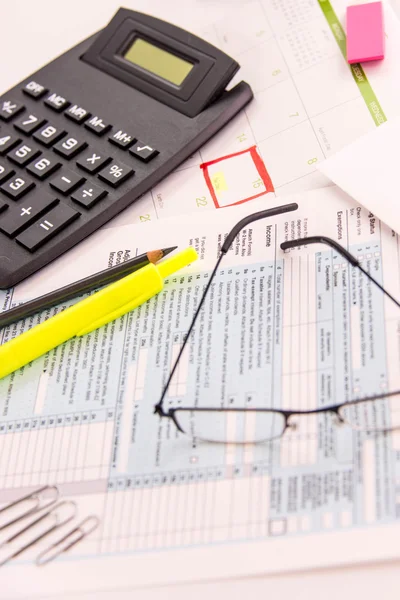 Tax preparation supplies, reading glasses and tax forms — Stock Photo, Image