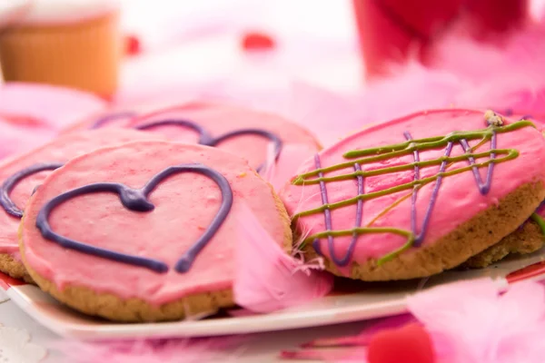 Valentines Day - decorations and cookies with pink frosting and — Stock Photo, Image