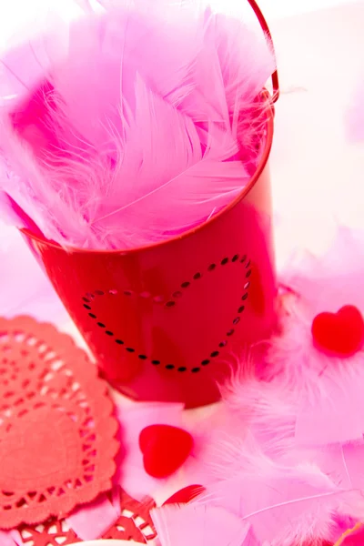 Valentines Day - decorations, pink feathers and heart shaped can — Stock Photo, Image
