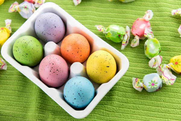 Colored Easter eggs in a white carton — Stock Photo, Image